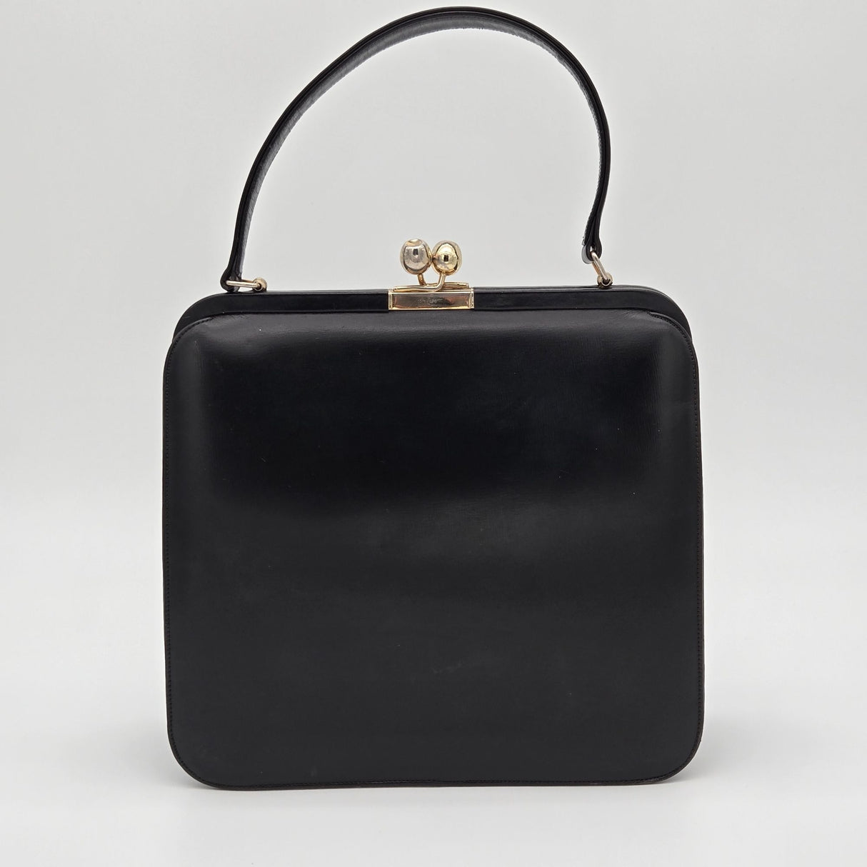 Vintage Black Leather Handbag By Bags By Supreme With Gold Kiss Lock Closure & Genuine Leather Lining