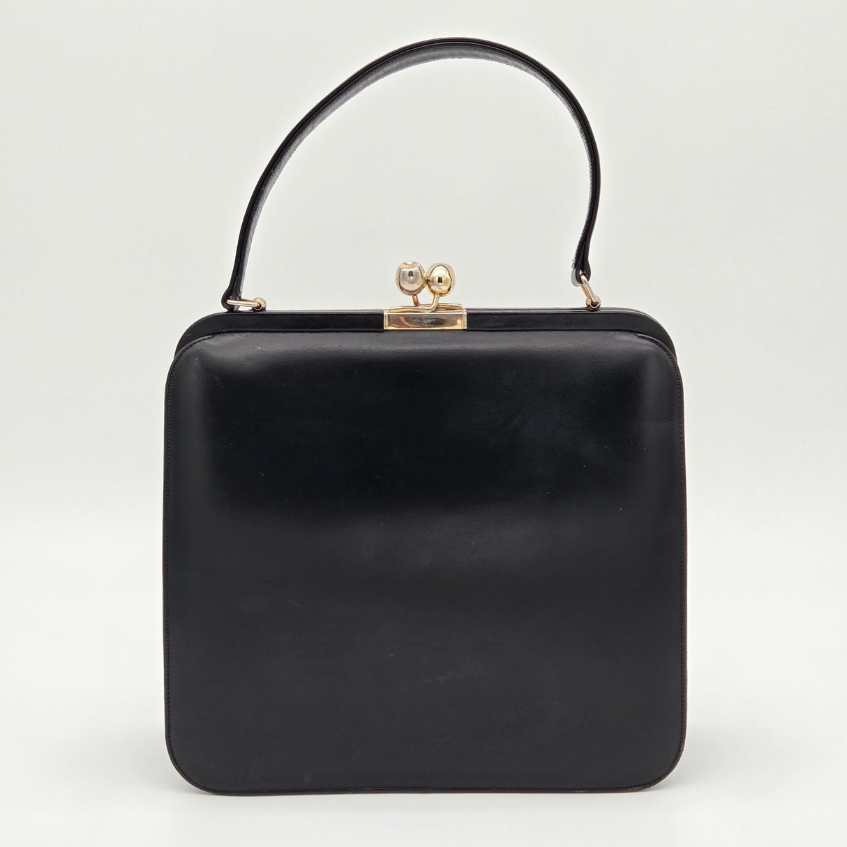 Vintage Black Leather Handbag By Bags By Supreme With Gold Kiss Lock Closure & Genuine Leather Lining