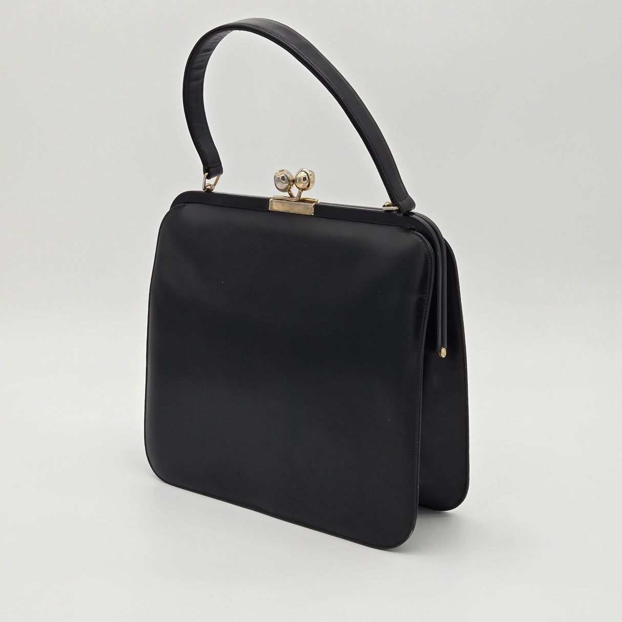 Vintage Black Leather Handbag By Bags By Supreme With Gold Kiss Lock Closure & Genuine Leather Lining